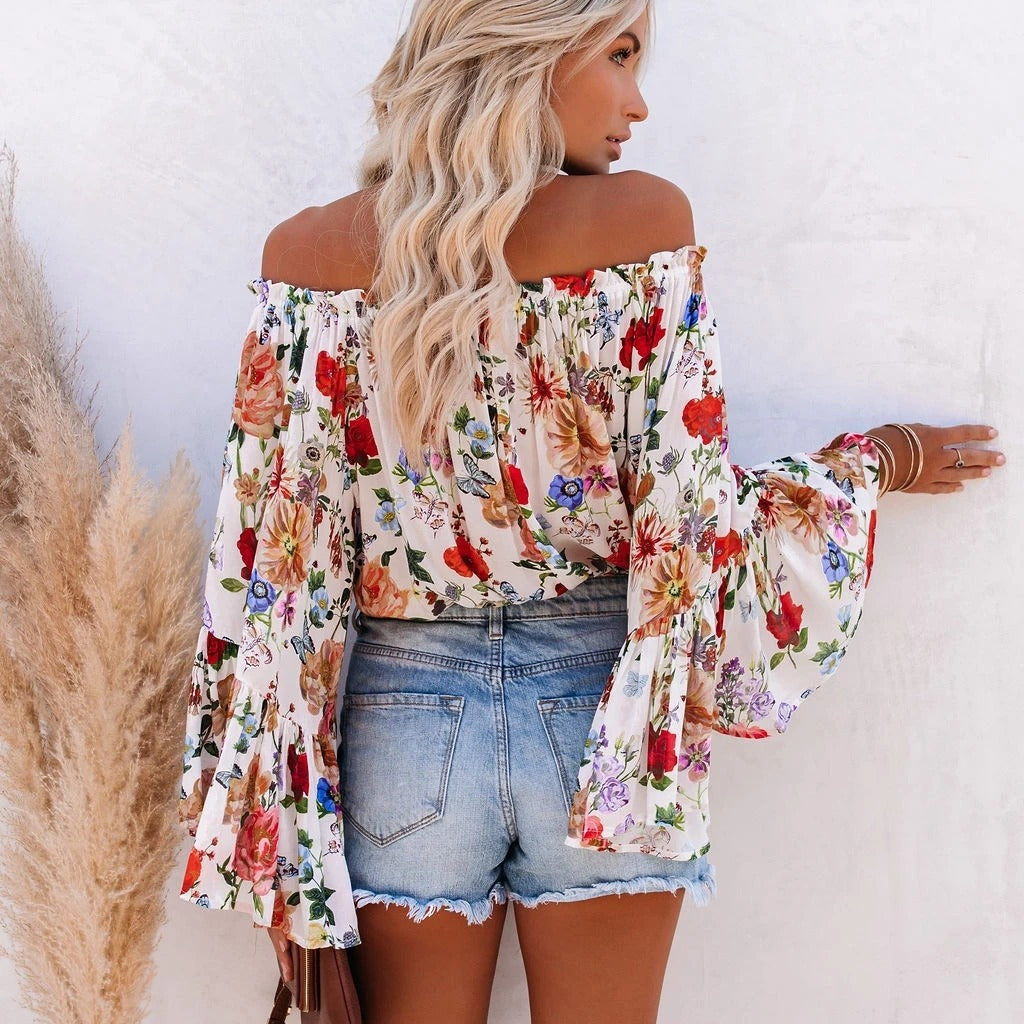 Trendsetting one-shoulder blouse with flared sleeves