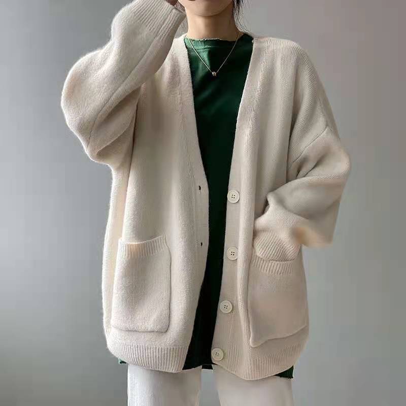 Women's long knit V-neck sweater with oversized buttons