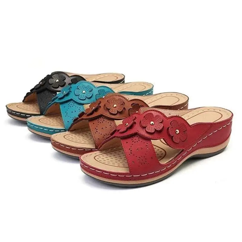 Roman sandals for women with floral embellishment and wedge heel