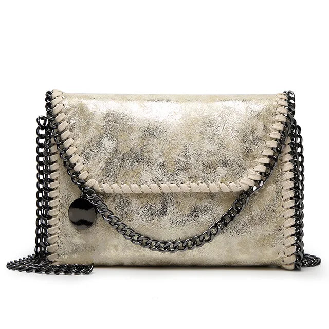 Isabel - Suede clutch with chain embellishment