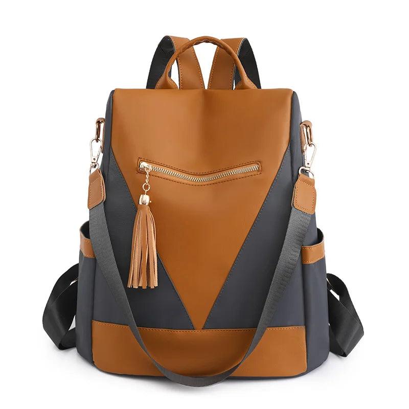 Valencia - Backpack in two-colour look with tassel pendant