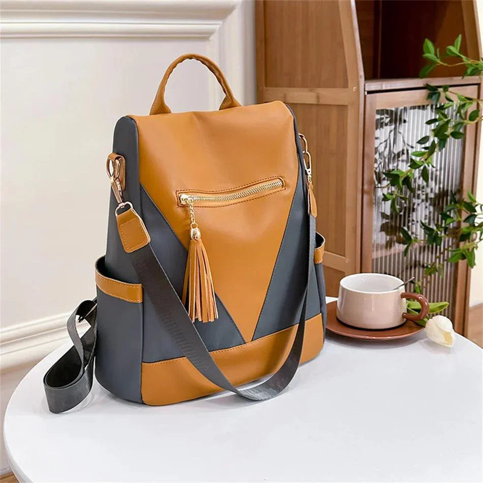 Valencia - Backpack in two-colour look with tassel pendant