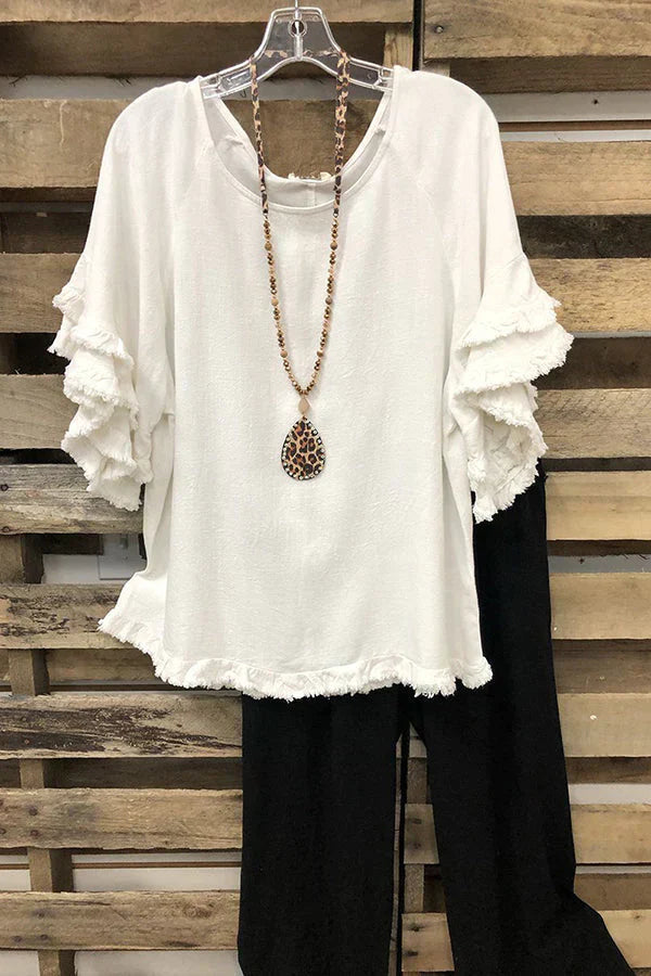 Ruffled cotton blouse with round neckline