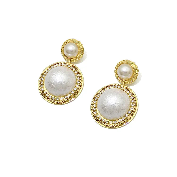 Round single pearl earrings