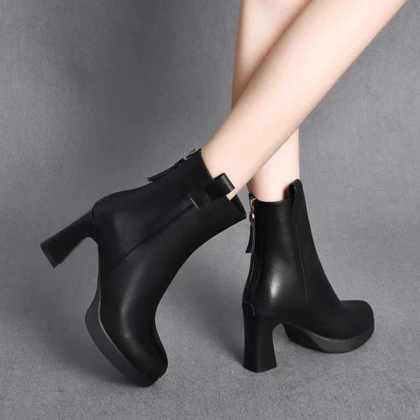 Stylish high-heeled boots with pointed toe